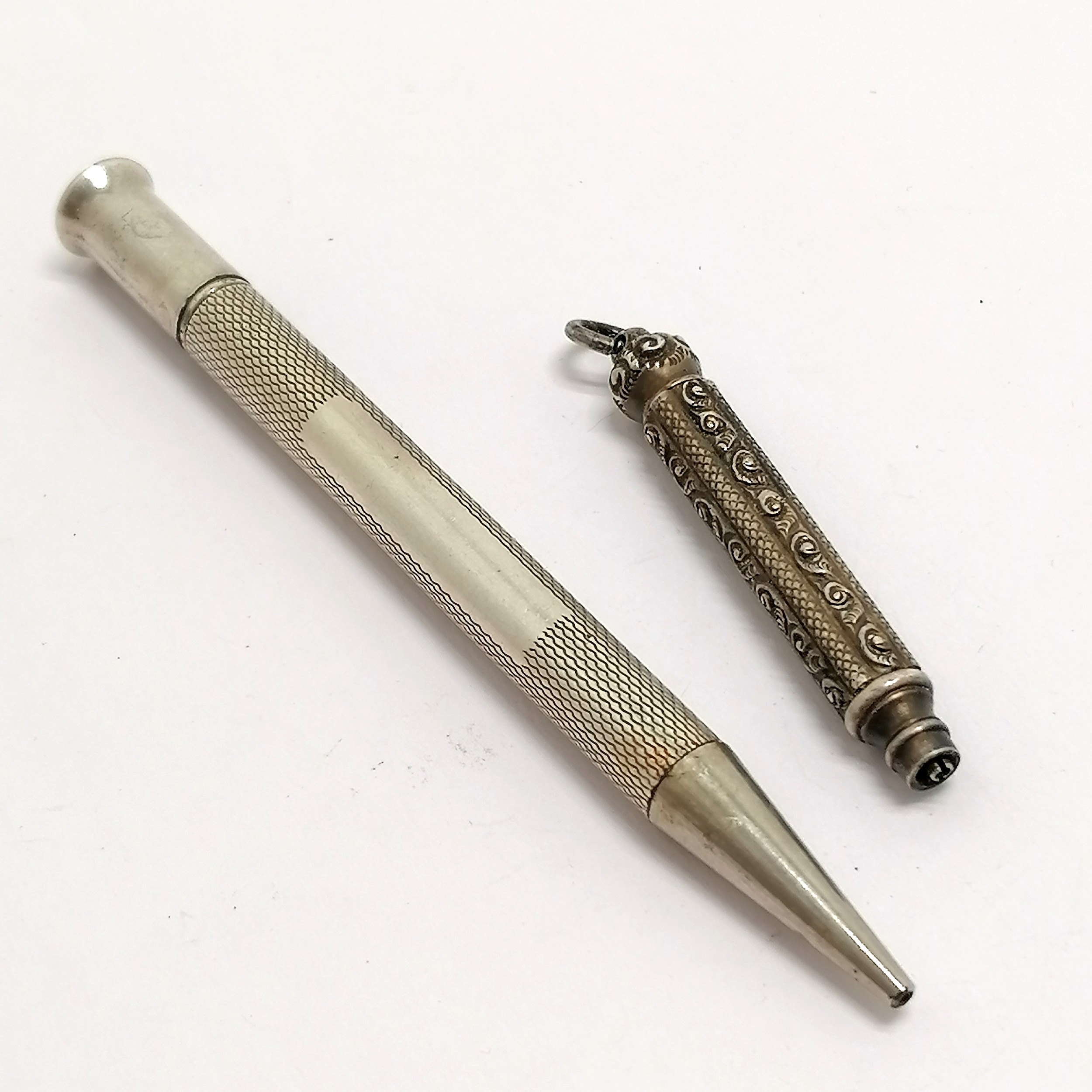 W S Hicks New York unmarked silver propelling pencil (8.5cm) t/w W M Ltd silver propelling pencil (