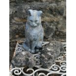 Crouching cat figure 40cm long a large seted cat with signs of a paint finish 37cm high and