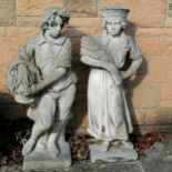 Large scale pair of figures, the male carrying a basket of grapes and the female carrying a