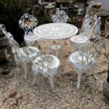 White aluminium circular garden table and 6 chairs with leaf detail, table 80cm diameter