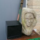 Carved granite head 46cm high on square black marble plinth 20cm x 20cm x 20cm