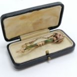 Antique unmarked rose gold brooch in the form of a sword set with green & red stone - 6.2cm long &