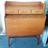 Mid-century teak dressing table, with slide to reveal recess and mirror, with 3 short drawers and
