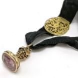 Antique yellow metal amethyst seal fob with 'la clé est à vous' (the key is yours) motto on a