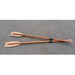 2 Wooden oars measuring 180cm long. In used condition.