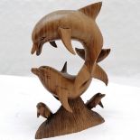 Carved wooden sculpture depicting dolphin figures. A/f fin. Measuring 34cm high.