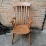Antique elm slatback Windsor armchair. Measures 110cm high x 60cm wide. No obvious damage.