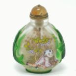 Oriental snuff bottle with agate stopper & green carp decoration in relief to the sides & script