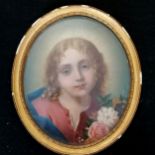 Antique oval oil on board of a girl holding flowers in original frame 24cm x 21cm