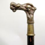 Antique ebonised walking cane with a bronze handle depicting a sleeping cherub, has signs of a