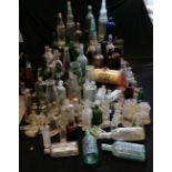 Large collection of glass bottles including blue poison, Boots the Chemist, Mansford & Baily of