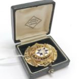 Antique yellow metal & unmarked gold enamel detail brooch - 4cm across & 9.1g total weight & in a