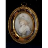 Boudoir portrait miniature of a lady wearing a hat signed Watt in a gilt brass & faux