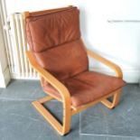 Stressless style armchair with tan leather upholstery, 95 cm high, 68 cm wide, 75 cm deep. In good