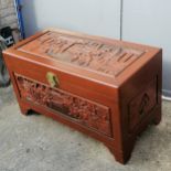 Oriental carved, Teak and Champhorwood blanket box, decorated with heavy carved village scenes ,