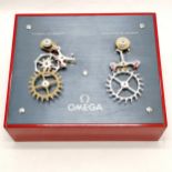 Original Omega shop display (by Ruegg) of their co-axial & Swiss Lever escapements on a box