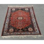 Good quality Persian Qashqai carpet with brick red ground. 105 x 152cm. In overall good used