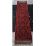 Red and black runner rug with medallion design detail. 252 x 261cm.