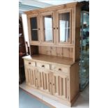 Antique style pine dresser, the top having 3 glazed panel doors, the base having 3 drawers and 3