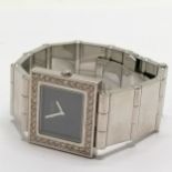Gucci diamond set bezel square quartz wristwatch on stainless steel bracelet with deployment clasp -