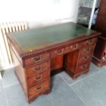 Edwardian mahogany Kneehole writing desk with green leather inset top, fitted with brush-slide, 9