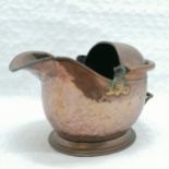 Antique copper helmet shaped coal scuttle, heavy used condition with split to lip, 30 cm high, 45 cm