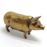 Antique novelty pig vesta case in brass with a hinged head lid - 4cm long & lacks tail