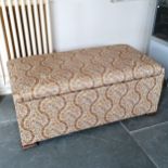 Fabric covered ottoman on shaped bracket feet. 108 cm length, 46 cm high, 55 cm deep. In good used