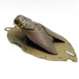 Good quality Oriental bronze bill clip in the form of a cicada on a part eaten leaf with signature