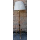 Good quality wrought iron standing lamp with gold leaf style decoration with a cream pleated