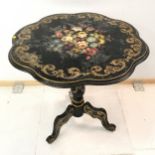 Antique ebonised tilt top centre table, with hand painted central floral medallion, within gilt