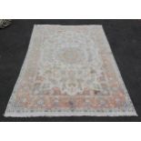 Large Kashan cream rug with central patterns and floral border. Measures 305cm long x 195cm wide.