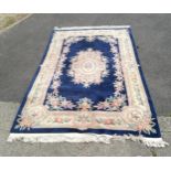 Chinese blue ground rug, with cream and floral central medallion , within floral border, 300 cm