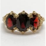9ct hallmarked gold ring set with 3 garnets - size N½ & 3.8g total weight ~ shank has wear