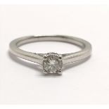 18ct hallmarked white gold diamond solitaire ring with diamond set sides by Jenny Packham - size N &