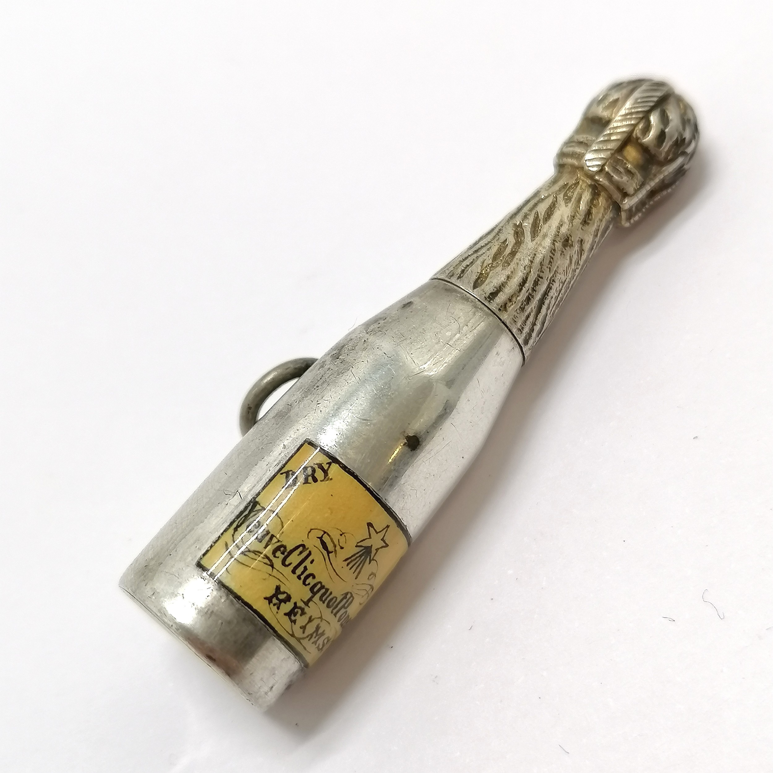 Unmarked antique silver novelty champagne bottle propelling pencil with enamel label detail -