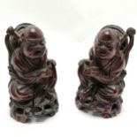 Pair of antique carved hardwood seated figures 12cm high - both have old splits