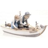 LLadro figure group 'Fishing with gramps' of Grandpa showing his Grandson and his dog how to fish in