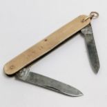 9ct gold mounted penknife with two blades 8cm long - total weight 21g- has a slight distortion to