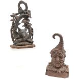 2 x cast iron doorstops ~ fox hunting related (28cm) & green man (old repair to top of hat)