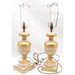Pair of classical style wooden lamps with gilt detail, 49 cm high, 17 cm wide.