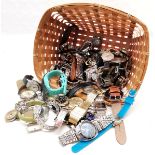 Qty of mostly quartz wristwatches in a wicker basket - for spares / repairs