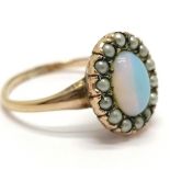 Antique dress ring in gold plated finish with white stone (moonstone?) and seed pearls - size L