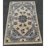 Chinese rug in cream depicting flowers. Measures 153 x 94cm. In very good used condition.