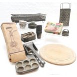 Qty of vintage kitchenalia inc bread board (29cm), wire racks, biscuit moulds, ricer, boxed whisk