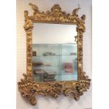 Antique gilt wood & gesso mirror with carved bird & swag detail (with later mirror plate) 101 cm