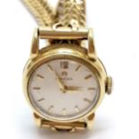 Omega ladies 18ct gold 19mm cased manual wind wristwatch with teardrop lugs on an 18ct marked gold