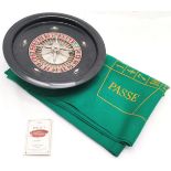 Antique wooden roulette wheel 30cm diameter and green baize board- small signs of moth otherwise