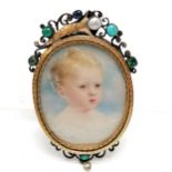 Antique portrait miniature of a child in a gilt metal frame with locket reverse and with