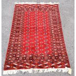 Persian red grounded rug with geometric pattern - 193cm x 125cm & in overall good used condition